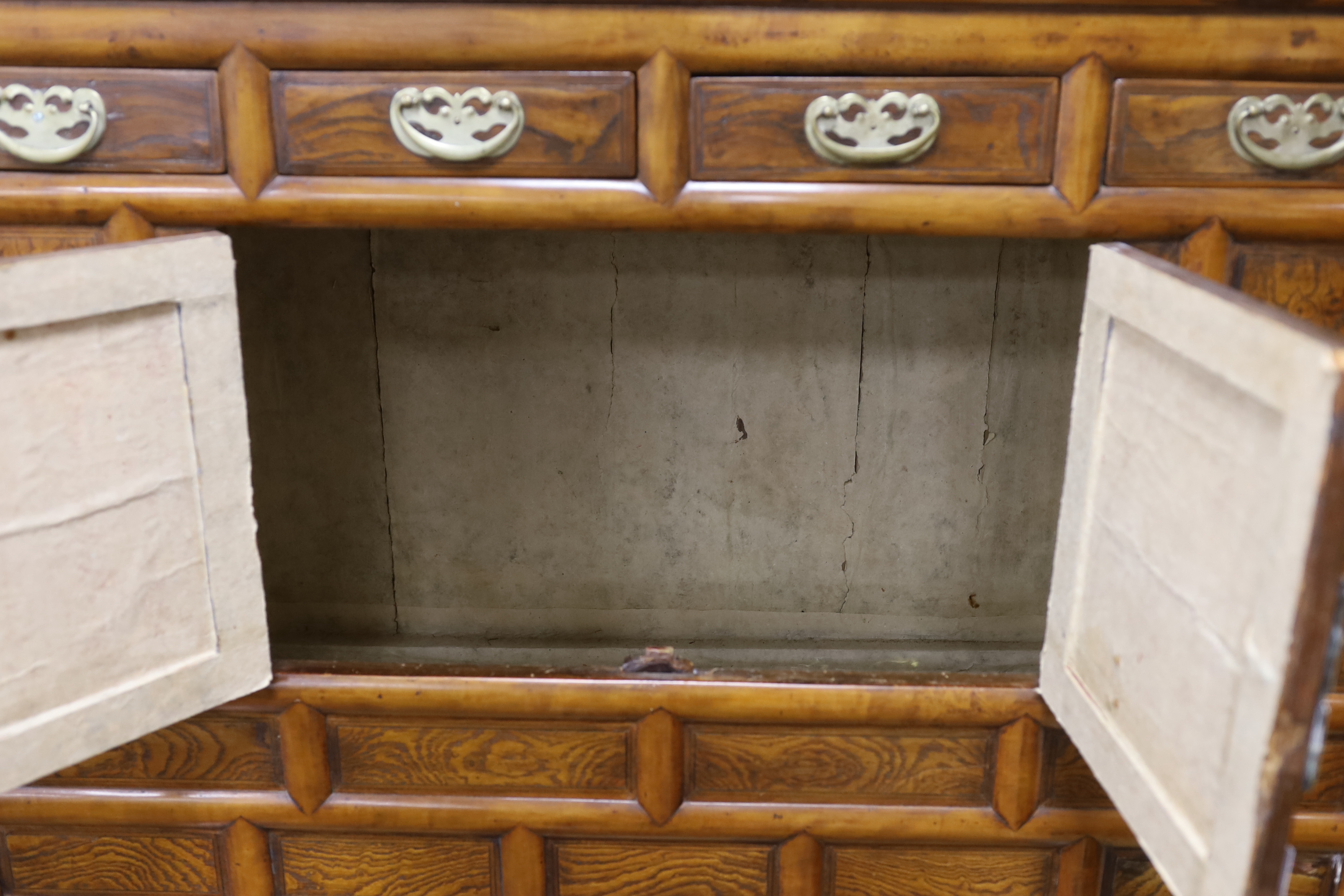 A Korean gilt metal mounted elm two part side cabinet, width 108cm, depth 46cm, height 149cm